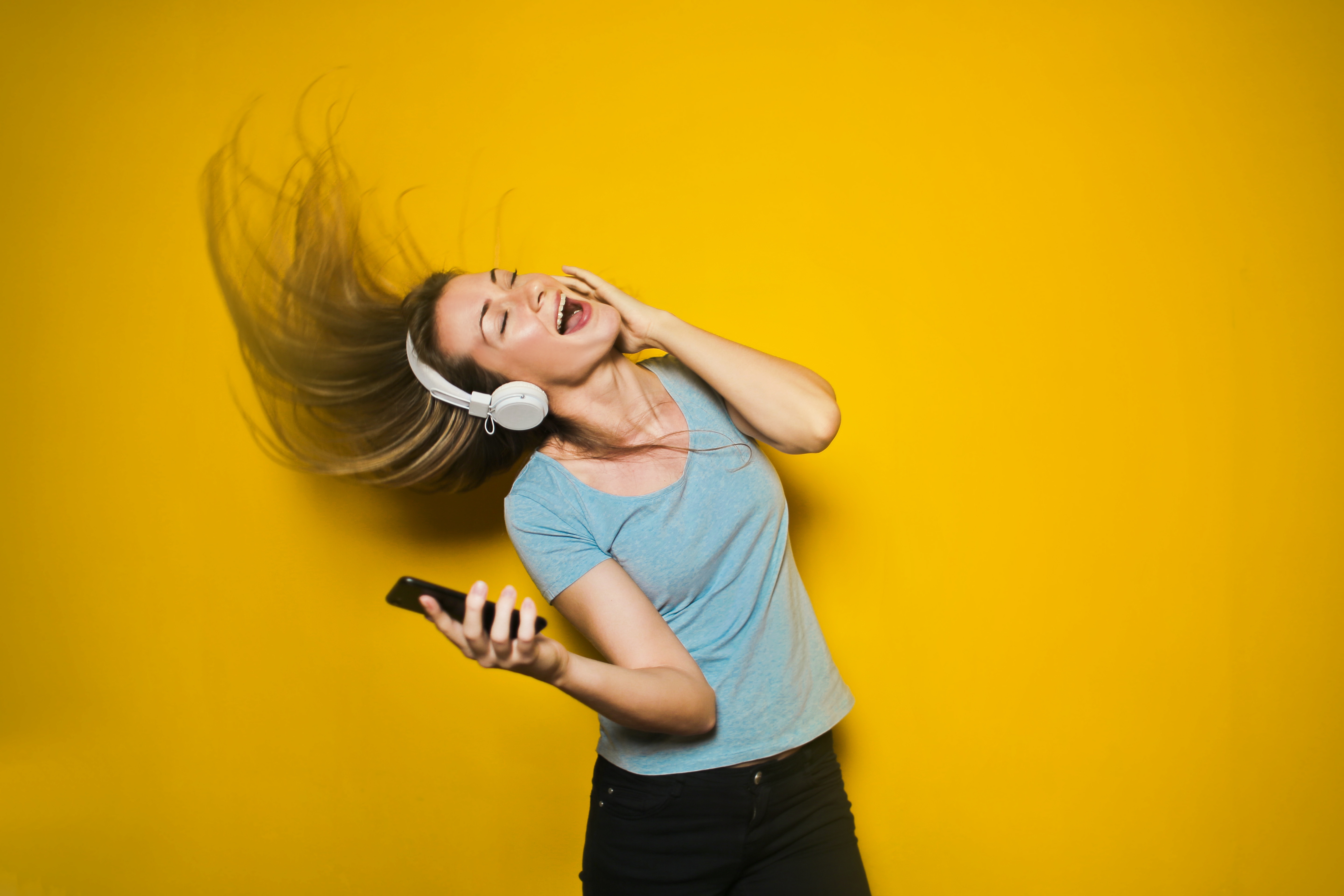 Individual listening to music and dancing